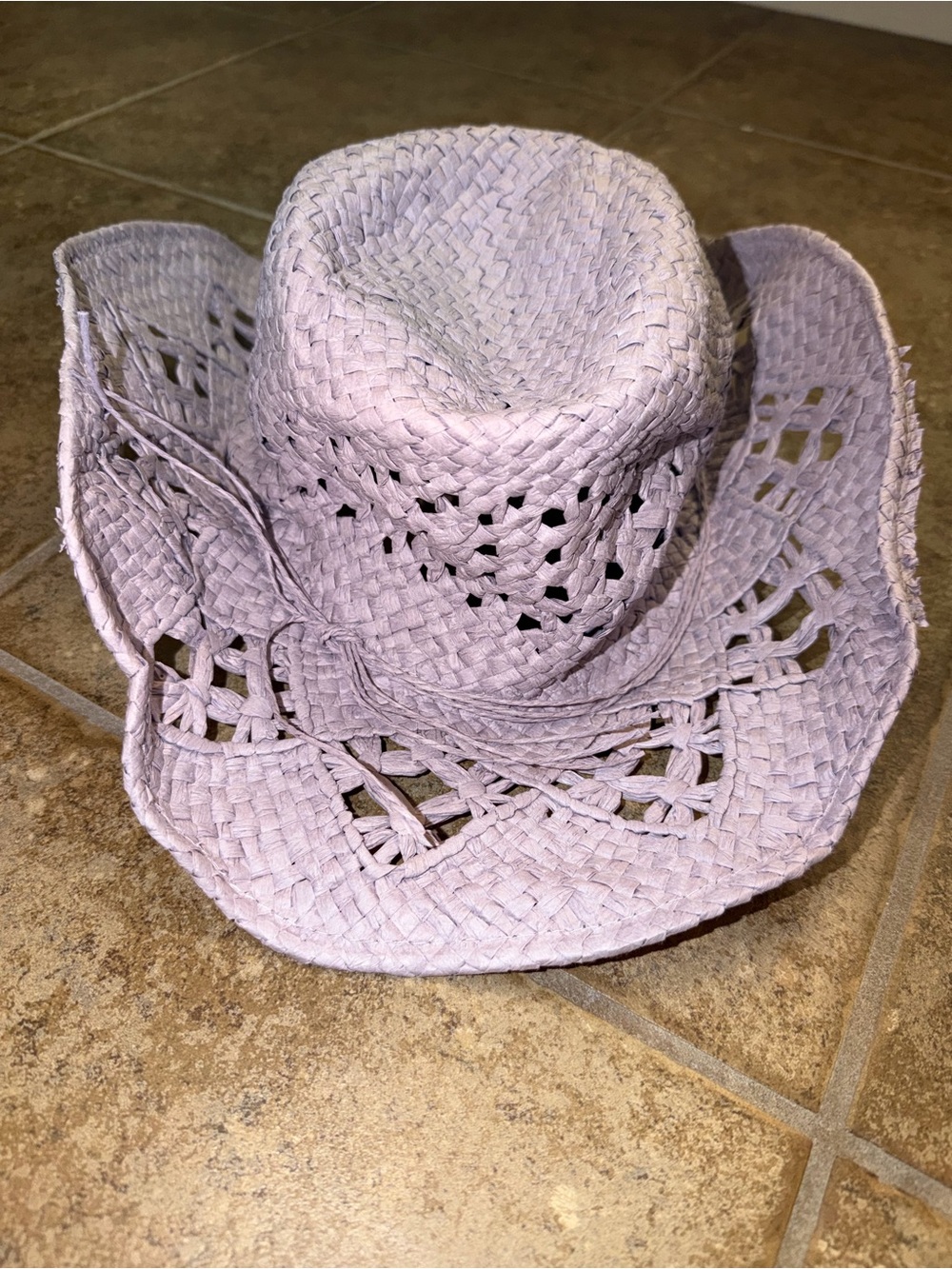 Urban Outfitters crochet straw hat with open and flexible knit design.